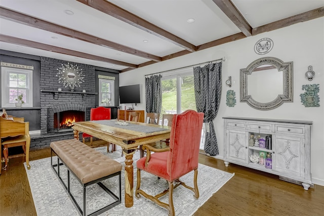 41 W Gate Rd, Suffern, NY 10901 - dining room featuring a brick fireplace, wood finished floors, beamed ceiling, and baseboards