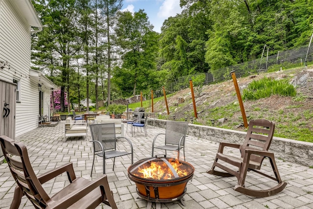 41 W Gate Rd, Suffern, NY 10901 - view of patio featuring a fire pit and view of wooded area