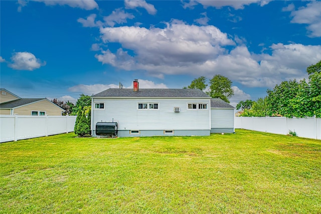 51 Franklin St, Brentwood, NY 11717 - back of property with a chimney and a shingled roof