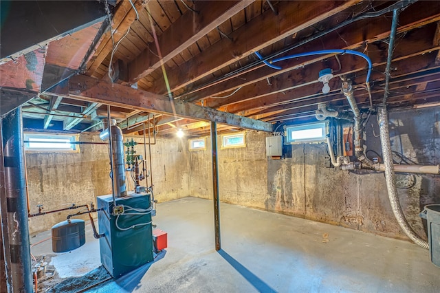 51 Franklin St, Brentwood, NY 11717 - basement featuring electric panel, plenty of natural light, and a heating unit