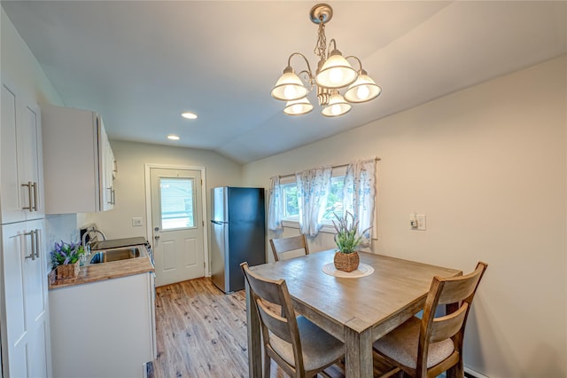 51 Franklin St, Brentwood, NY 11717 - dining room with light wood-style floors, a chandelier, lofted ceiling, and recessed lighting