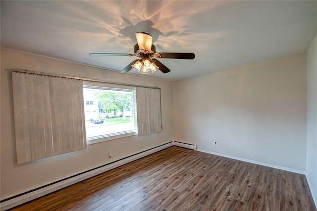 51 Franklin St, Brentwood, NY 11717 - unfurnished room featuring baseboard heating, wood finished floors, a ceiling fan, and baseboards