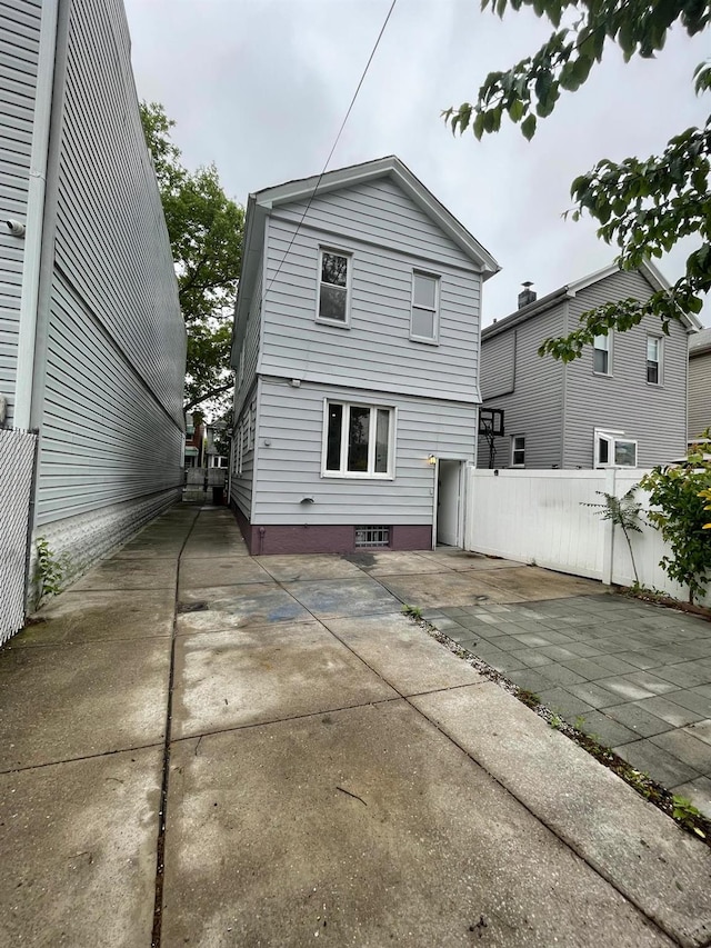 70-31 71st Pl, Glendale, NY 11385 - rear view of property featuring a patio area