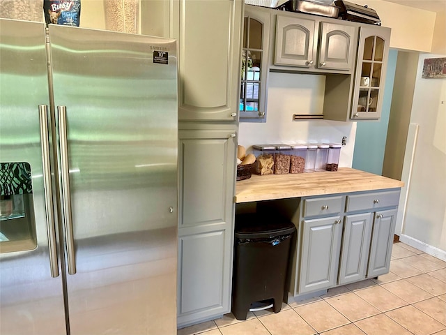 5646 Rte 82, Clinton Corners, NY 12514 - kitchen featuring stainless steel fridge, gray cabinets, glass insert cabinets, light tile patterned floors, and light countertops