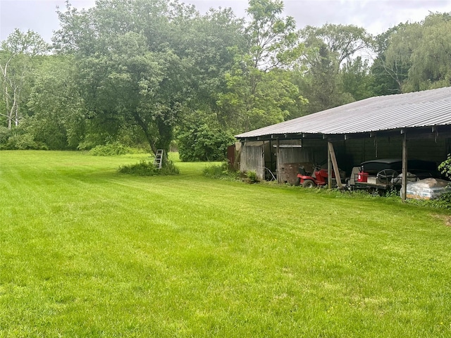 5646 Rte 82, Clinton Corners, NY 12514 - view of green lawn featuring an outbuilding, a wooded view, and an outdoor structure