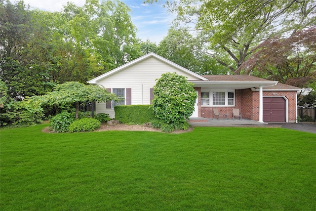 64 Church St, Syosset, NY 11791 - view of front of home featuring a front yard, a garage, driveway, and brick siding