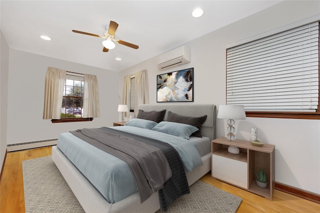 64 Church St, Syosset, NY 11791 - bedroom with a wall unit AC, a baseboard radiator, wood finished floors, a ceiling fan, and recessed lighting
