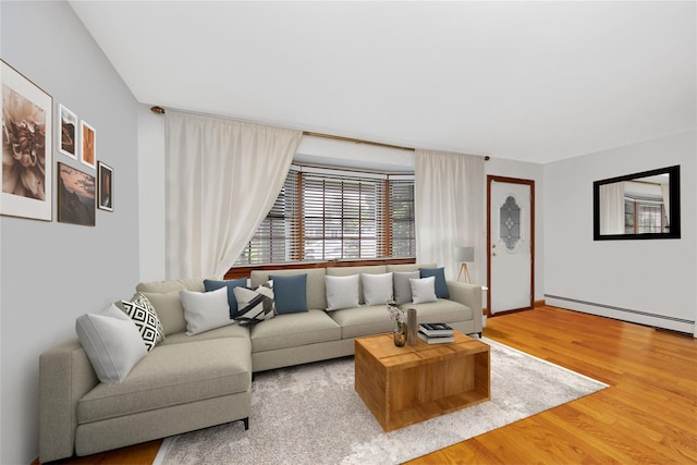 64 Church St, Syosset, NY 11791 - living area featuring wood finished floors, a baseboard radiator, and baseboards