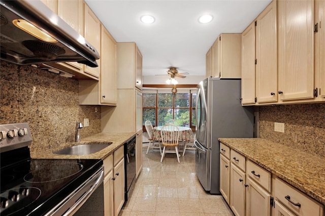 64 Church St, Syosset, NY 11791 - kitchen with appliances with stainless steel finishes, range hood, ceiling fan, a sink, and light stone counters