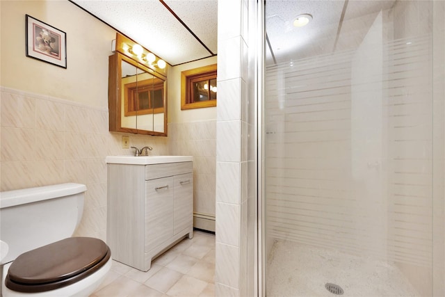 64 Church St, Syosset, NY 11791 - full bath featuring a baseboard radiator, tile walls, a shower stall, vanity, and toilet