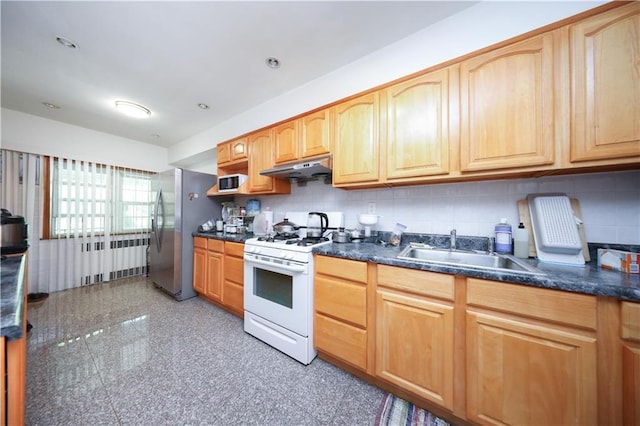 2366 E 29th St, Brooklyn, NY 11229 - kitchen featuring white gas range, freestanding refrigerator, granite tiled floors, a sink, and under cabinet range hood