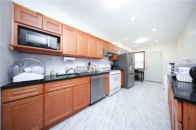 2366 E 29th St, Brooklyn, NY 11229 - kitchen with stainless steel appliances, a sink, under cabinet range hood, light marble finish flooring, and recessed lighting