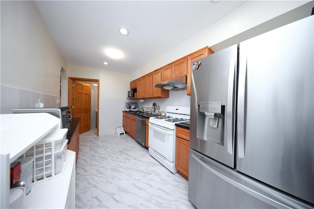2366 E 29th St, Brooklyn, NY 11229 - kitchen featuring appliances with stainless steel finishes, under cabinet range hood, light marble finish floors, brown cabinets, and dark countertops