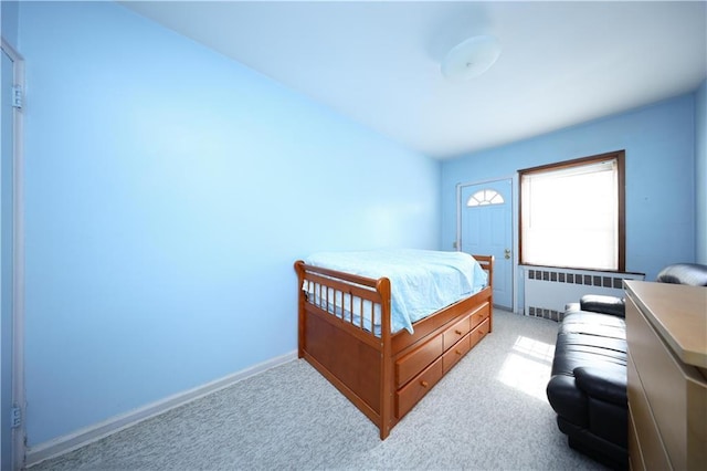 2366 E 29th St, Brooklyn, NY 11229 - bedroom with radiator, light colored carpet, and baseboards
