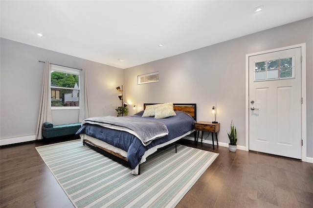 13915 Coolidge Ave, Briarwood, NY 11435 - bedroom featuring wood finished floors, baseboards, baseboard heating, and recessed lighting