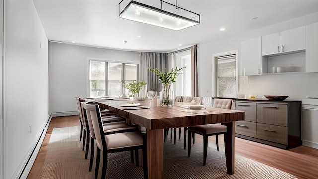 2825 Wellman Ave, Bronx, NY 10461 - dining room with baseboard heating, light wood-style floors, and recessed lighting