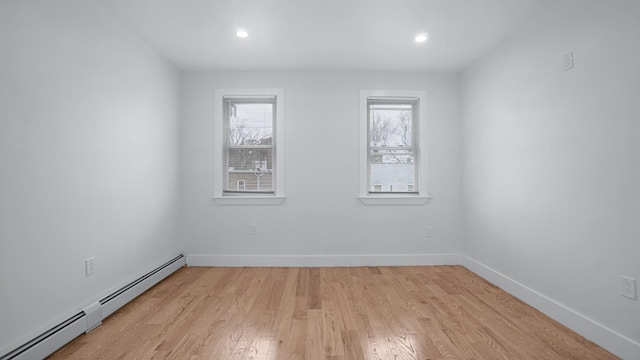 2825 Wellman Ave, Bronx, NY 10461 - unfurnished room with a baseboard radiator, light wood finished floors, baseboards, and recessed lighting