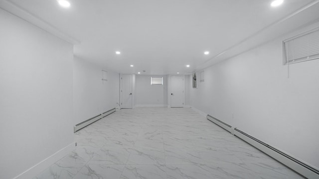 2825 Wellman Ave, Bronx, NY 10461 - finished basement with a baseboard heating unit, recessed lighting, light marble finish flooring, and baseboards
