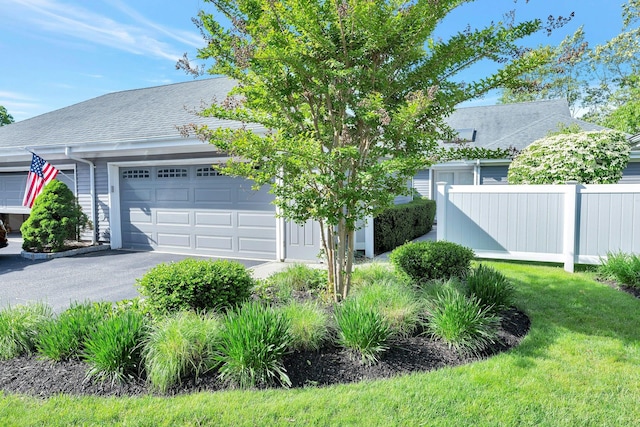 276 Dockside Ct, Moriches, NY 11955 - view of front of house featuring an attached garage, asphalt driveway, and roof with shingles