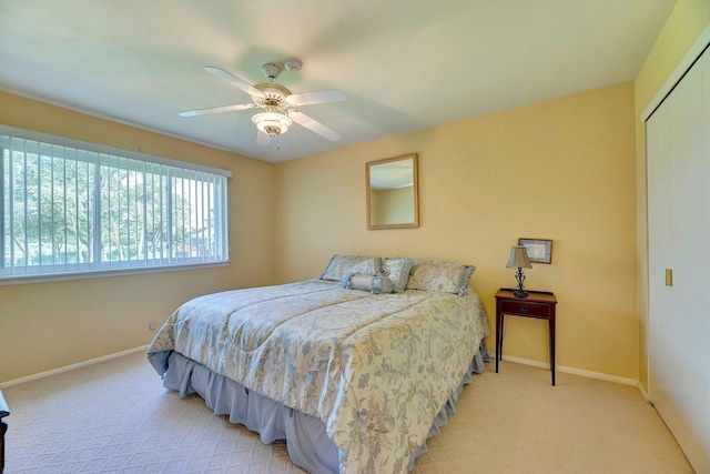 276 Dockside Ct, Moriches, NY 11955 - bedroom featuring a closet, baseboards, light colored carpet, and a ceiling fan