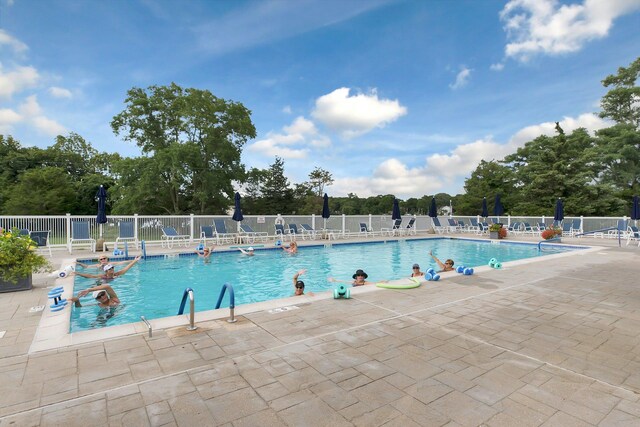 276 Dockside Ct, Moriches, NY 11955 - community pool featuring a patio and view of scattered trees