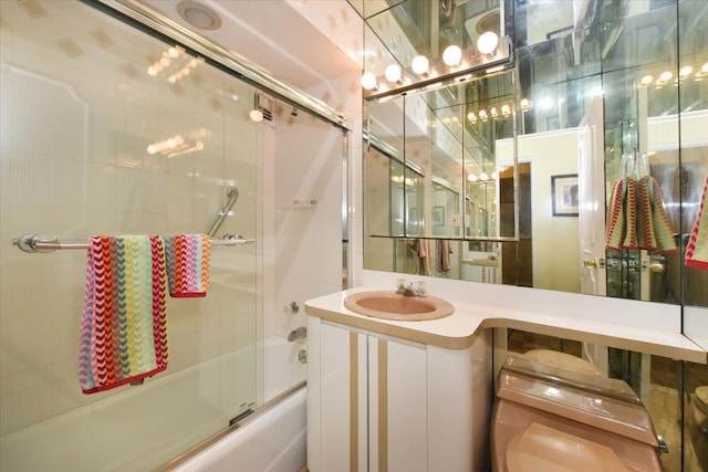 40 Stoner Ave Unit 1-I, Great Neck, NY 11021 - full bathroom featuring shower / bath combination with glass door, vanity, and toilet
