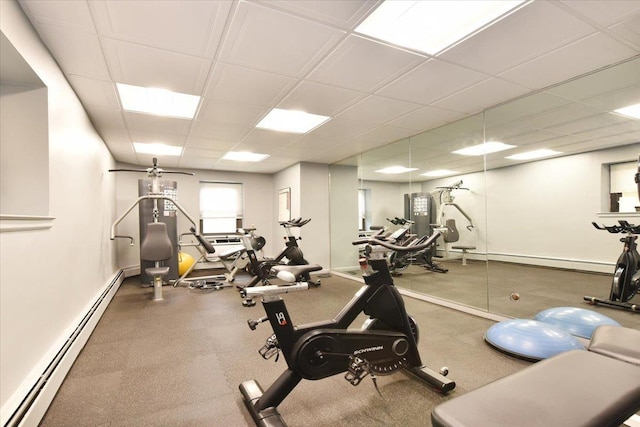 40 Stoner Ave Unit 1-I, Great Neck, NY 11021 - workout area featuring a baseboard radiator, a paneled ceiling, and baseboard heating