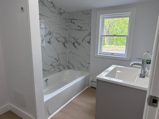 19 N Rd, Highland, NY 12528 - full bathroom with vanity, baseboard heating, wood finished floors, and  shower combination