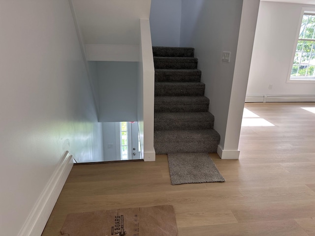 19 N Rd, Highland, NY 12528 - staircase featuring wood finished floors, baseboards, and baseboard heating