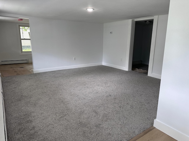 19 N Rd, Highland, NY 12528 - spare room with a baseboard radiator, baseboards, and carpet floors