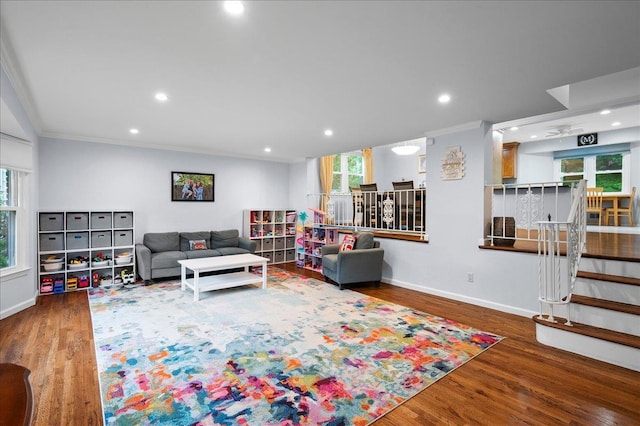 71 Harlan Dr, New Rochelle, NY 10804 - living room featuring crown molding, wood finished floors, plenty of natural light, recessed lighting, and stairs