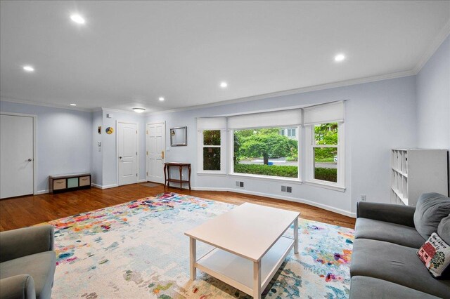 71 Harlan Dr, New Rochelle, NY 10804 - living room with crown molding, wood finished floors, and recessed lighting