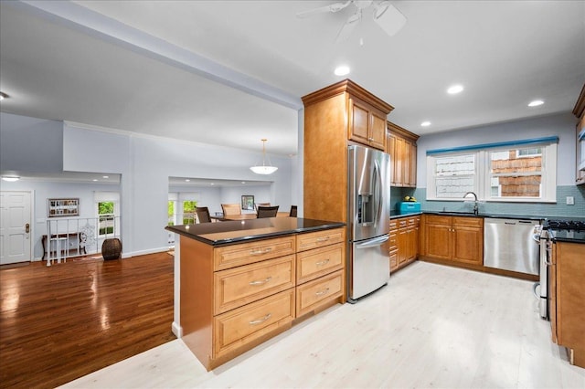 71 Harlan Dr, New Rochelle, NY 10804 - kitchen with stainless steel appliances, dark countertops, light wood-style flooring, ceiling fan, and recessed lighting