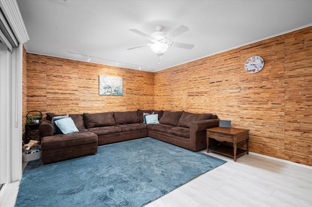 71 Harlan Dr, New Rochelle, NY 10804 - living area featuring a ceiling fan, rail lighting, wood finished floors, and wooden walls