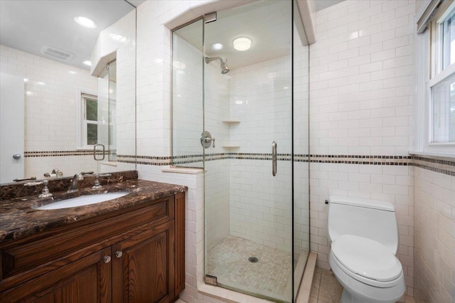71 Harlan Dr, New Rochelle, NY 10804 - bathroom with tile walls, a shower stall, and vanity