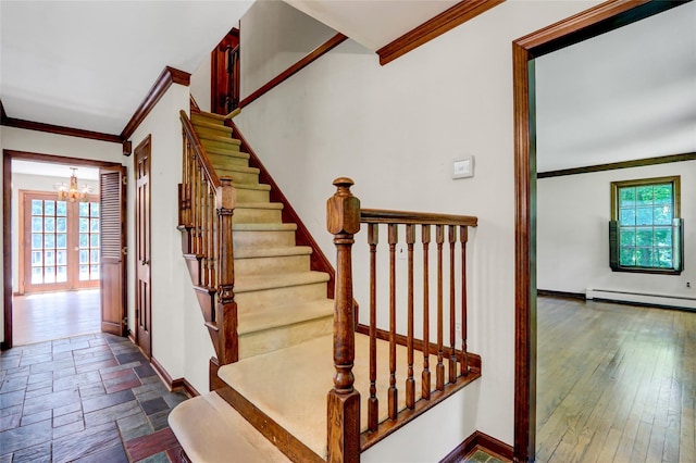 14 Wainscott Ln, East Setauket, NY 11733 - stairs featuring ornamental molding, a baseboard heating unit, a chandelier, and baseboards