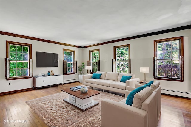 14 Wainscott Ln, East Setauket, NY 11733 - living room featuring a baseboard heating unit, hardwood / wood-style floors, ornamental molding, and baseboards