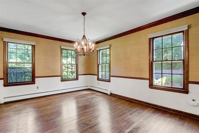 14 Wainscott Ln, East Setauket, NY 11733 - empty room featuring plenty of natural light, a chandelier, dark wood finished floors, and crown molding
