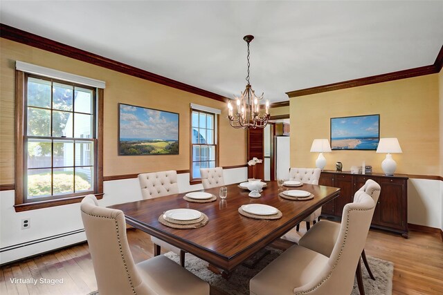 14 Wainscott Ln, East Setauket, NY 11733 - dining room with a chandelier, light wood-style floors, a baseboard radiator, and crown molding