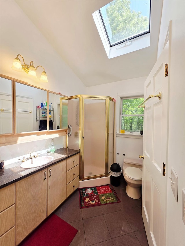 81 Anchor St, Riverhead, NY 11901 - bathroom with tile patterned floors, vanity, toilet, a stall shower, and a skylight