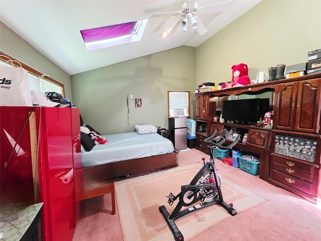 81 Anchor St, Riverhead, NY 11901 - carpeted bedroom with vaulted ceiling, a skylight, and a ceiling fan