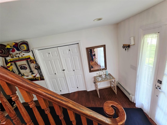 81 Anchor St, Riverhead, NY 11901 - foyer entrance with a baseboard heating unit and dark wood finished floors