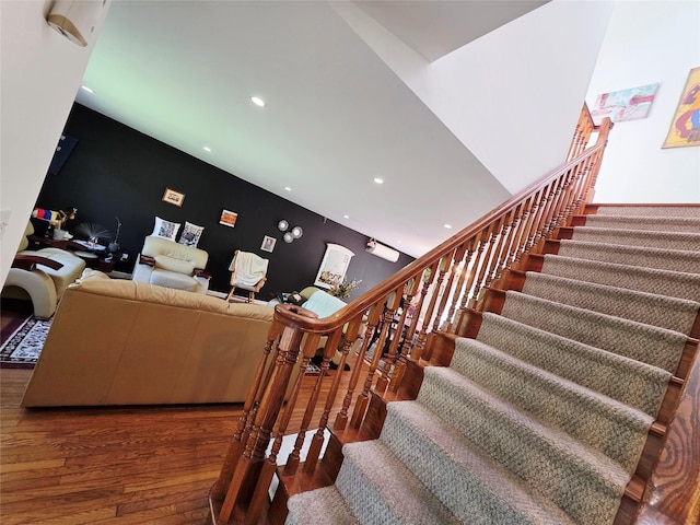 81 Anchor St, Riverhead, NY 11901 - stairs featuring wood finished floors, recessed lighting, and an accent wall