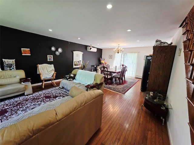 81 Anchor St, Riverhead, NY 11901 - living room featuring a chandelier, dark wood-type flooring, recessed lighting, a baseboard radiator, and baseboards