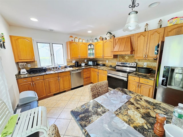 81 Anchor St, Riverhead, NY 11901 - kitchen with appliances with stainless steel finishes, custom range hood, decorative backsplash, light tile patterned flooring, and a sink