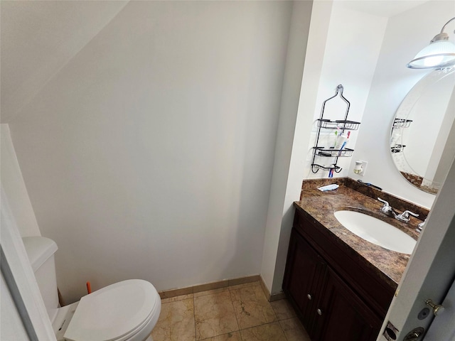 81 Anchor St, Riverhead, NY 11901 - half bathroom with toilet, vanity, marble look tile flooring, and baseboards
