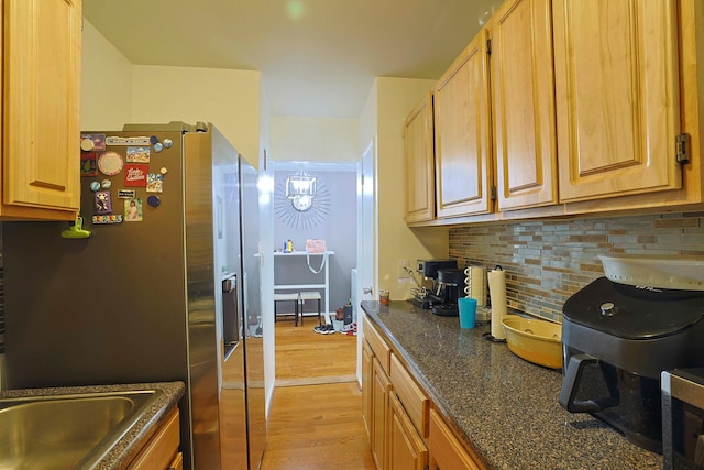 780 Bronx River Rd Unit A16, Bronx, NY 10708 - kitchen featuring tasteful backsplash, light wood-style floors, stainless steel fridge with ice dispenser, dark stone counters, and a sink