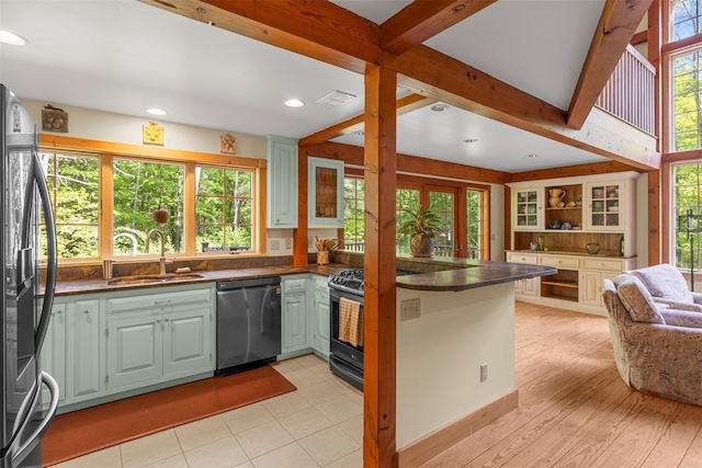 577 Fiddlers Bridge Rd, Staatsburg, NY 12580 - kitchen featuring appliances with stainless steel finishes, a sink, dark countertops, a peninsula, and green cabinets