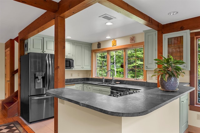 577 Fiddlers Bridge Rd, Staatsburg, NY 12580 - kitchen with stainless steel refrigerator with ice dispenser, a sink, a peninsula, dark countertops, and dishwasher