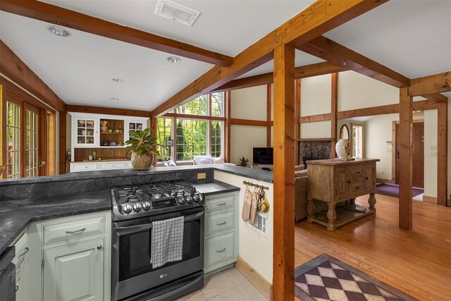 577 Fiddlers Bridge Rd, Staatsburg, NY 12580 - kitchen featuring stainless steel range with gas cooktop, dark countertops, and open floor plan
